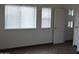 Bedroom features tile floors, light filled windows with blinds, and white trim at 6620 W Shaw Butte Dr, Glendale, AZ 85304