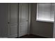 Bedroom closet with sliding doors and a window bringing in natural light at 6620 W Shaw Butte Dr, Glendale, AZ 85304
