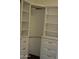 Walk-in closet featuring custom built-in shelving and drawers, offering ample storage space for an organized wardrobe at 6620 W Shaw Butte Dr, Glendale, AZ 85304