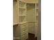 Walk-in closet featuring custom built-in shelving and drawers, offering ample storage space for an organized wardrobe at 6620 W Shaw Butte Dr, Glendale, AZ 85304
