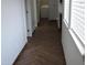 Hallway featuring tile floors with access to a washer and dryer at 6620 W Shaw Butte Dr, Glendale, AZ 85304