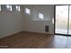 Living room has slider to backyard and three decorative windows with blinds at 6620 W Shaw Butte Dr, Glendale, AZ 85304