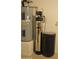 Image shows the home's water system with a water heater and water filtration system at 6620 W Shaw Butte Dr, Glendale, AZ 85304