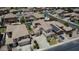 An aerial view of a suburban neighborhood with a tile roof home, solar panels and mature landscaping at 6840 S Crystal Way, Chandler, AZ 85249