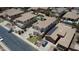 Aerial view of a home with a tile roof, solar panels, landscaping, and a residential street at 6840 S Crystal Way, Chandler, AZ 85249