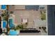 Birds eye view of a house with solar panels and backyard oasis including a pool at 6840 S Crystal Way, Chandler, AZ 85249