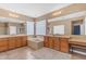 Spacious bathroom features dual vanities, large mirrors, a soaking tub, and stylish decor elements at 6840 S Crystal Way, Chandler, AZ 85249