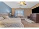Relaxing bedroom features a large window, neutral tones, plush bedding, and a seating area for comfort at 6840 S Crystal Way, Chandler, AZ 85249