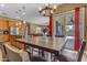 Dining table with seating situated near sliding door and kitchen, perfect for gatherings at 6840 S Crystal Way, Chandler, AZ 85249
