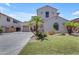 Charming two-story home with a well-maintained lawn and decorative palm trees at 6840 S Crystal Way, Chandler, AZ 85249