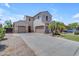 Inviting two-story home featuring a three-car garage and manicured landscaping at 6840 S Crystal Way, Chandler, AZ 85249