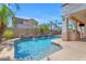 Stunning backyard pool with built-in water features, lush landscaping, and a built-in BBQ at 6840 S Crystal Way, Chandler, AZ 85249