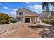 Backyard features a patio seating area and low maintenance desert landscaping at 706 N El Dorado Dr, Gilbert, AZ 85233