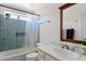 Bathroom with updated vanity and tub with blue tiled walls at 706 N El Dorado Dr, Gilbert, AZ 85233