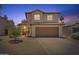 Two-story home with a two car garage and desert landscaping at 706 N El Dorado Dr, Gilbert, AZ 85233