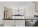 A kitchen with stainless steel appliances and granite countertops overlooks the dining area with a bay window at 706 N El Dorado Dr, Gilbert, AZ 85233