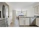 A modern kitchen with stainless steel appliances, granite countertops, and an open view of the dining room at 706 N El Dorado Dr, Gilbert, AZ 85233