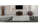 Bright and spacious living room featuring a plush gray sofa, high ceilings, media center, and neutral carpet at 706 N El Dorado Dr, Gilbert, AZ 85233