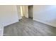 This bedroom features a closet and hardwood floors at 7116 W Sophie Ln, Laveen, AZ 85339