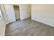 This bedroom features a closet and hardwood floors at 7116 W Sophie Ln, Laveen, AZ 85339