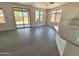 Spacious dining area with sliding glass door, tile floors, and open layout to the gourmet kitchen at 7116 W Sophie Ln, Laveen, AZ 85339