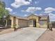 Charming single-story home featuring a well-maintained landscape, tile roof and an inviting covered entryway at 7116 W Sophie Ln, Laveen, AZ 85339