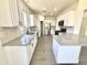 Modern kitchen featuring white cabinets, subway tile backsplash, and granite countertops, blending style and functionality at 7116 W Sophie Ln, Laveen, AZ 85339