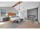 Serene primary bedroom featuring a modern fireplace and vaulted ceiling at 733 W El Camino Dr, Phoenix, AZ 85021