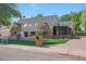 Charming two-story brick home with mature trees and a well-manicured lawn at 733 W El Camino Dr, Phoenix, AZ 85021
