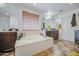 Relaxing bathroom with large soaking tub, dual vanities, and great natural light at 7419 S 25Th Dr, Phoenix, AZ 85041