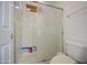 Shower with glass doors and a white toilet beside it in this bathroom at 7419 S 25Th Dr, Phoenix, AZ 85041