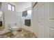 Bathroom showcasing a toilet, tiled floor, shower with a glass door, and closet at 7419 S 25Th Dr, Phoenix, AZ 85041