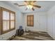 This bedroom has light walls, wood floors, and shutters on the windows at 7419 S 25Th Dr, Phoenix, AZ 85041