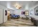 Bedroom featuring ceiling fan, wood-like flooring, natural light, and musical instruments set at 7419 S 25Th Dr, Phoenix, AZ 85041