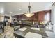 Dining area featuring brown cabinets and a stylish light fixture at 7419 S 25Th Dr, Phoenix, AZ 85041