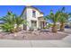 Charming two-story home featuring a well-maintained landscape and beautiful desert palm trees at 7419 S 25Th Dr, Phoenix, AZ 85041