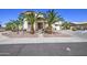 Inviting home exterior with stone accents, palm trees, and a charming walkway to the front door at 7419 S 25Th Dr, Phoenix, AZ 85041