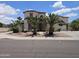 Inviting two-story home with desert landscaping, stone accents, and a driveway basketball hoop at 7419 S 25Th Dr, Phoenix, AZ 85041