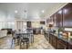 Spacious kitchen with a breakfast bar and stainless steel appliances at 7419 S 25Th Dr, Phoenix, AZ 85041