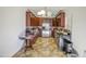 Kitchen with dark wood cabinets, stainless steel appliances, and tile floors at 7419 S 25Th Dr, Phoenix, AZ 85041