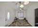 Bright living room features tile flooring, ceiling fan, and natural light from the window at 7419 S 25Th Dr, Phoenix, AZ 85041