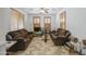 Relaxing living room featuring comfortable sofas, neutral decor, and abundant natural light at 7419 S 25Th Dr, Phoenix, AZ 85041