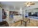 Bright, open-concept living room with tile flooring, neutral paint and furniture at 7419 S 25Th Dr, Phoenix, AZ 85041