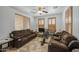 Bright living room with comfortable seating, plantation shutters, and neutral decor at 7419 S 25Th Dr, Phoenix, AZ 85041