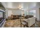 This spacious living room has a couch set and built-in shelving surrounding a television at 7419 S 25Th Dr, Phoenix, AZ 85041