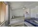 Open main bedroom has wood floors, a ceiling fan, private entrance, and high ceilings at 7419 S 25Th Dr, Phoenix, AZ 85041