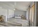 Large main bedroom showcasing open layout, wood-look floors, high ceilings and private entrance at 7419 S 25Th Dr, Phoenix, AZ 85041
