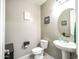 Powder room with stylish fixtures, neutral paint, and tile flooring at 761 W Desert Hollow Dr, San Tan Valley, AZ 85143
