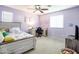 A delightful bedroom features soft lighting, cozy decor, and comfortable furnishings at 761 W Desert Hollow Dr, San Tan Valley, AZ 85143