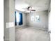 An empty bedroom with neutral walls, plush carpeting, and a ceiling fan at 761 W Desert Hollow Dr, San Tan Valley, AZ 85143